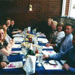 Many people gathered around a table